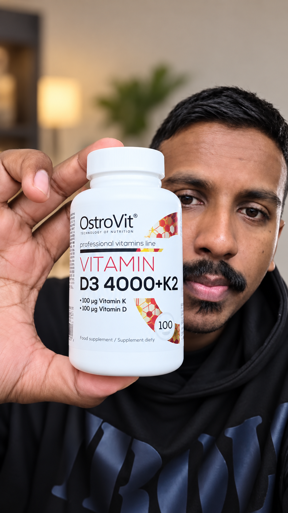 Dharvesh holding OstroVit Vitamin D3 4000 with K2