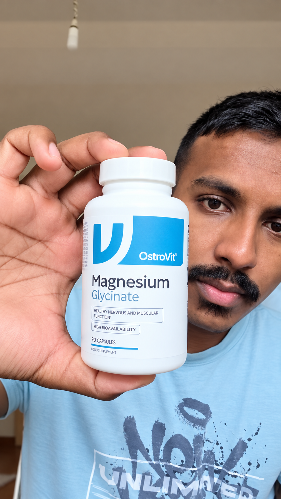 Dharvesh holding OstroVit Magnesium Glycinate